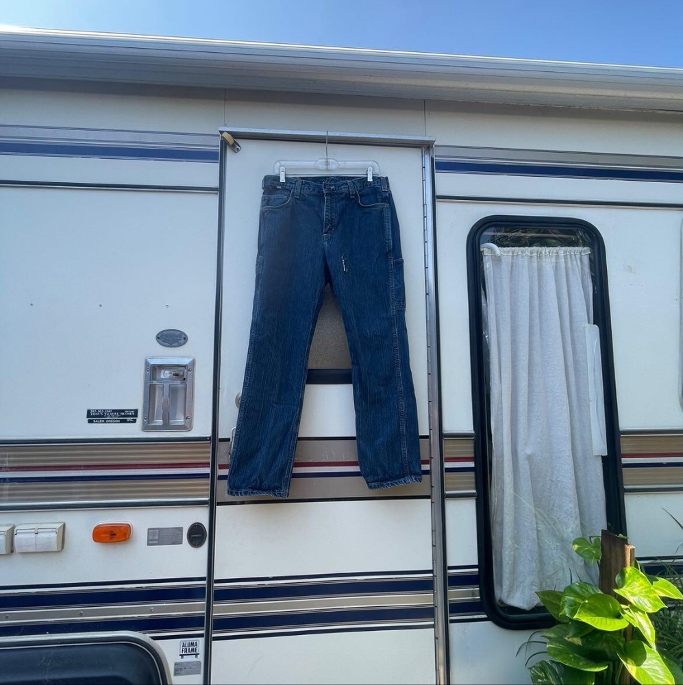 Like new Carhartt Jeans with slit like hole left side 34×30